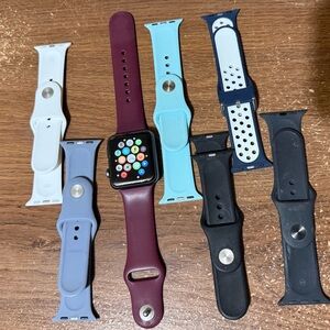 Apple Watch Series 1 with 7 bands and charger